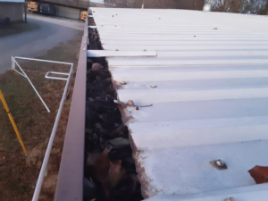 Clogged Metal Roof Gutters